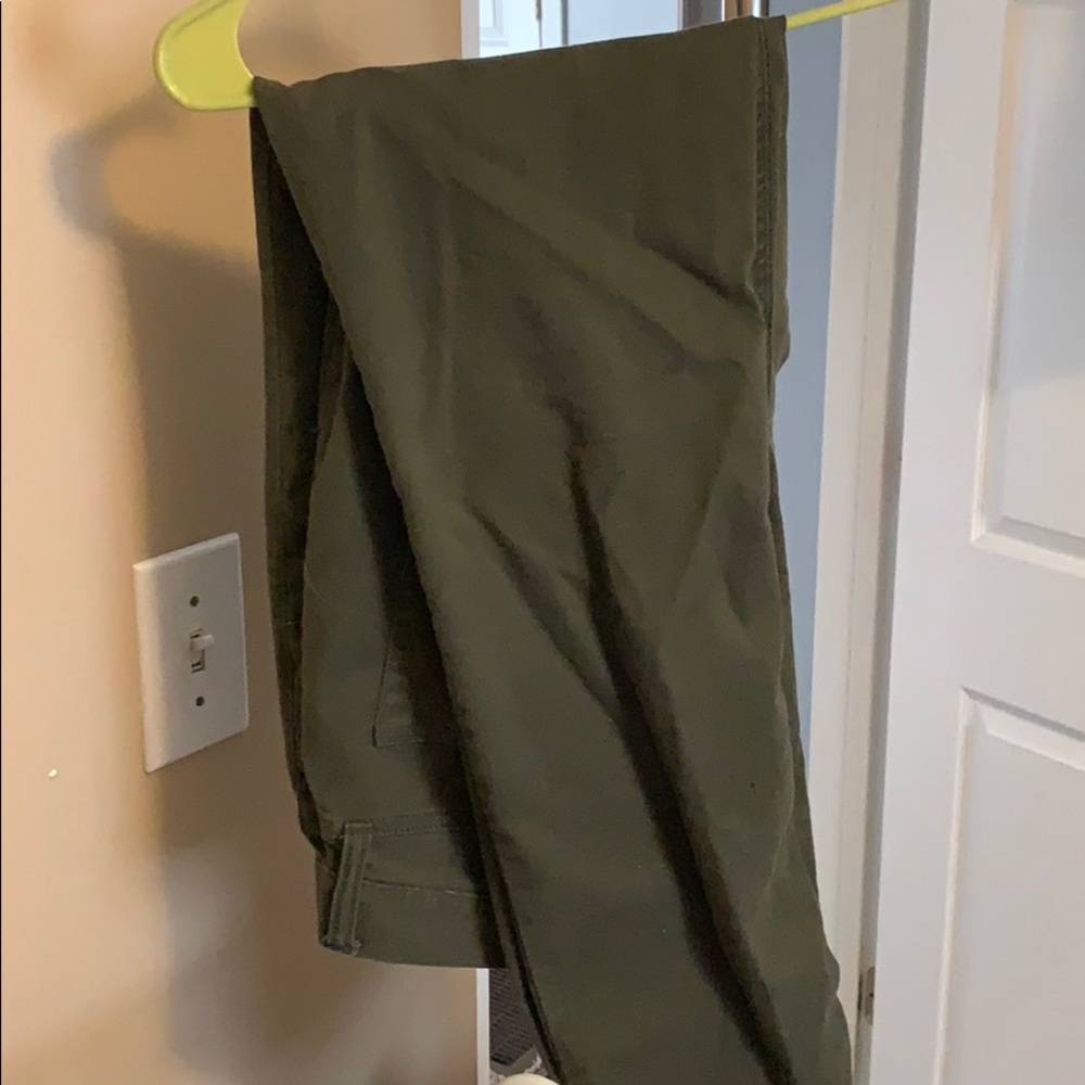 Green pants. No rips, worn a hand full of times.